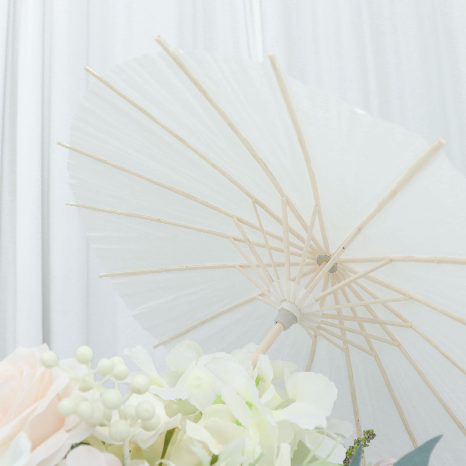 White bamboo parasol umbrella for wedding decor and photo props.