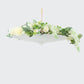 White parasol umbrella decorated with flowers, perfect for weddings and events.