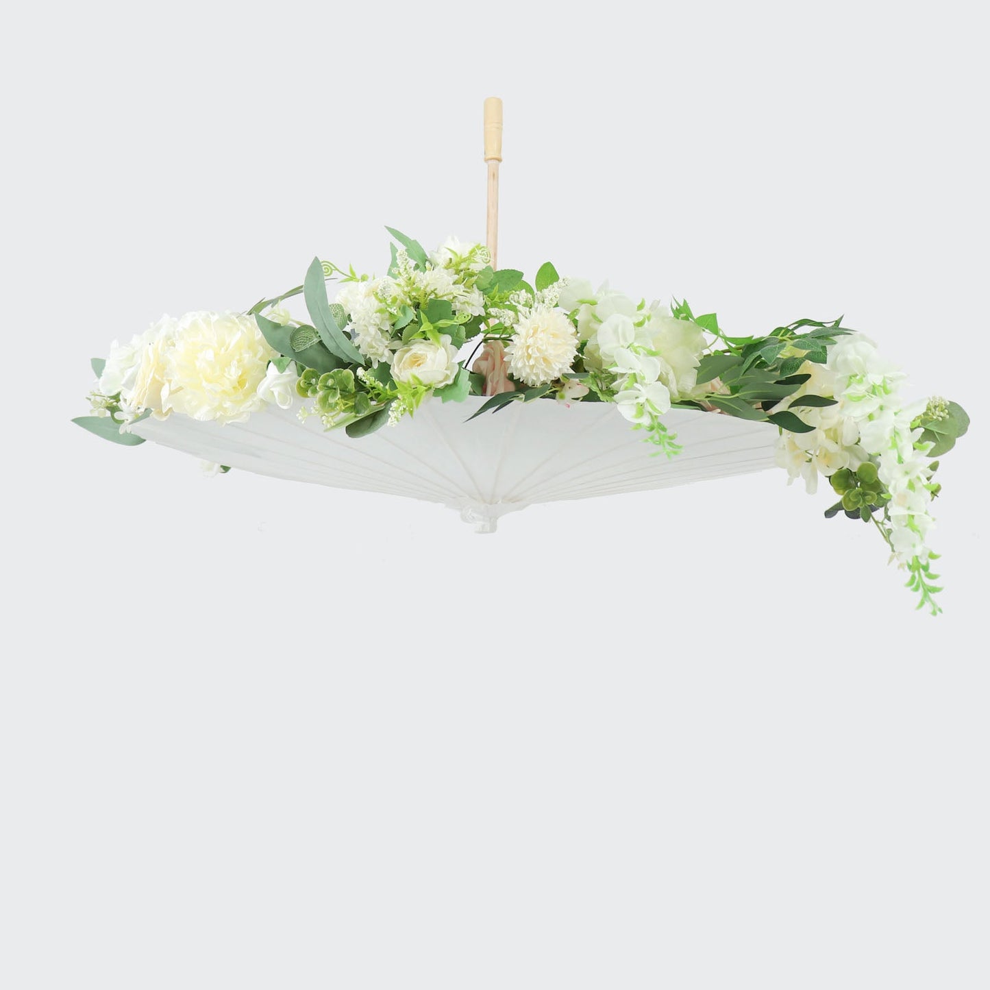 White parasol umbrella decorated with flowers, perfect for weddings and events.
