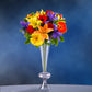 Reversible crystal ball trumpet glass vase filled with vibrant flowers.