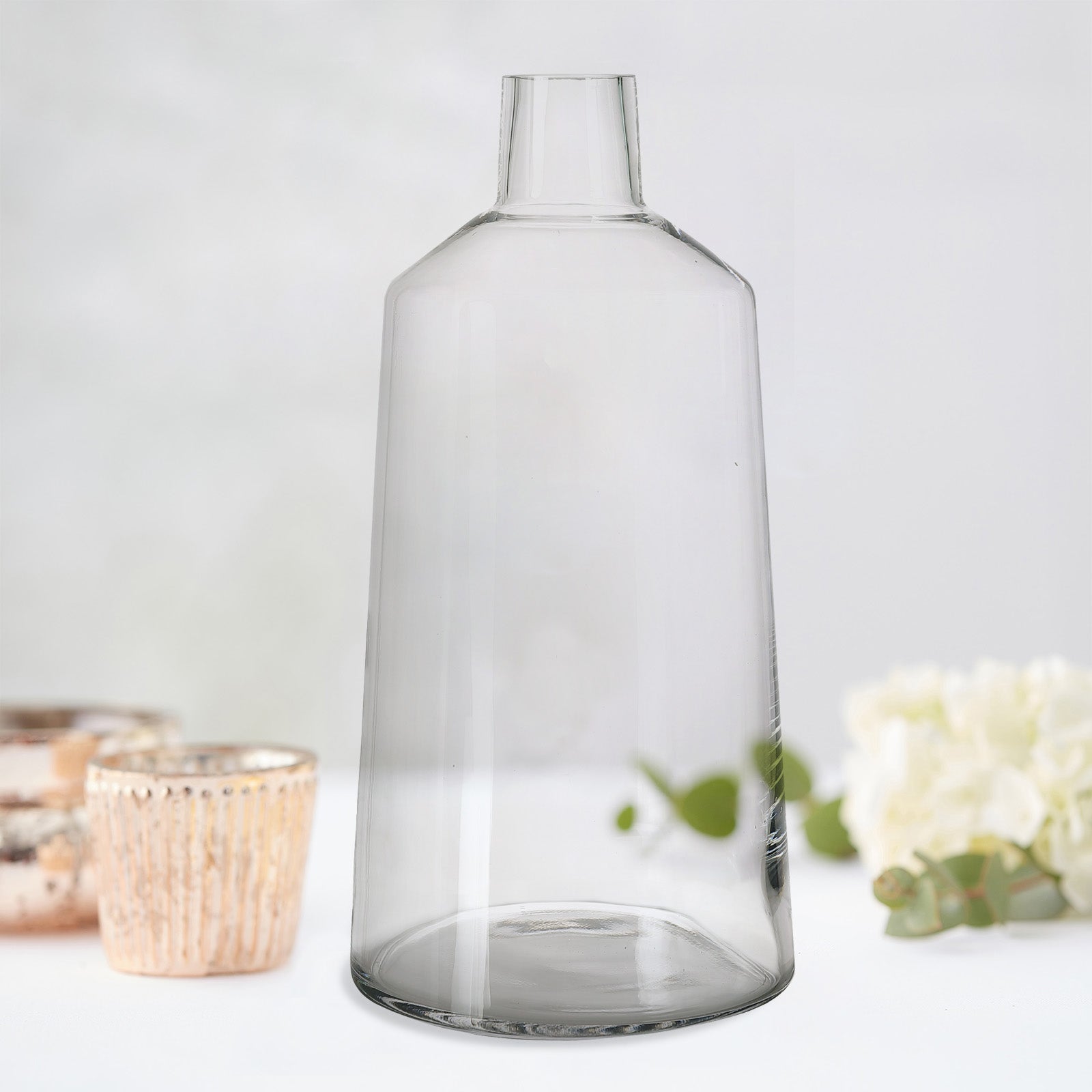 Clear glass tapered neck flower bud vase centerpiece.