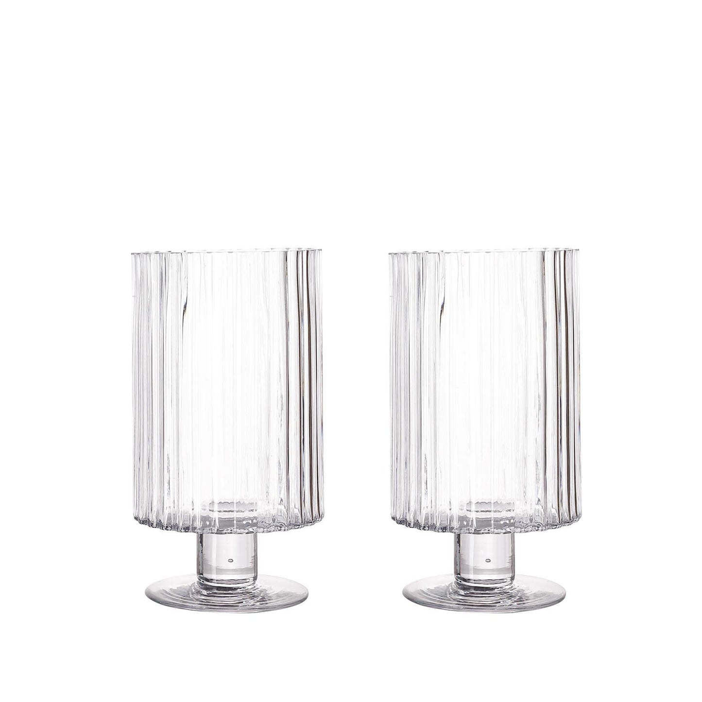Clear ribbed glass vases, perfect for candles or floral arrangements.