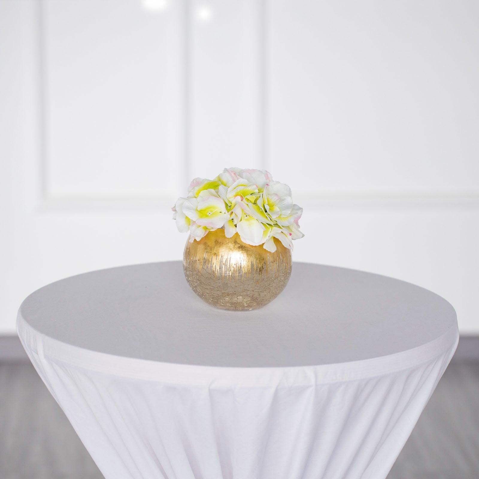 Gold foiled crackle glass bubble vase with flowers.