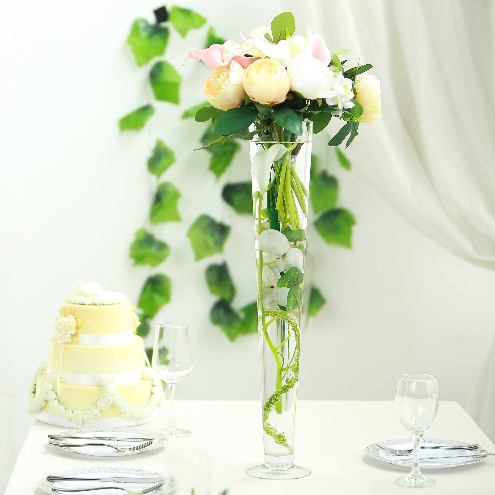 Clear heavy duty trumpet glass vase with flowers.