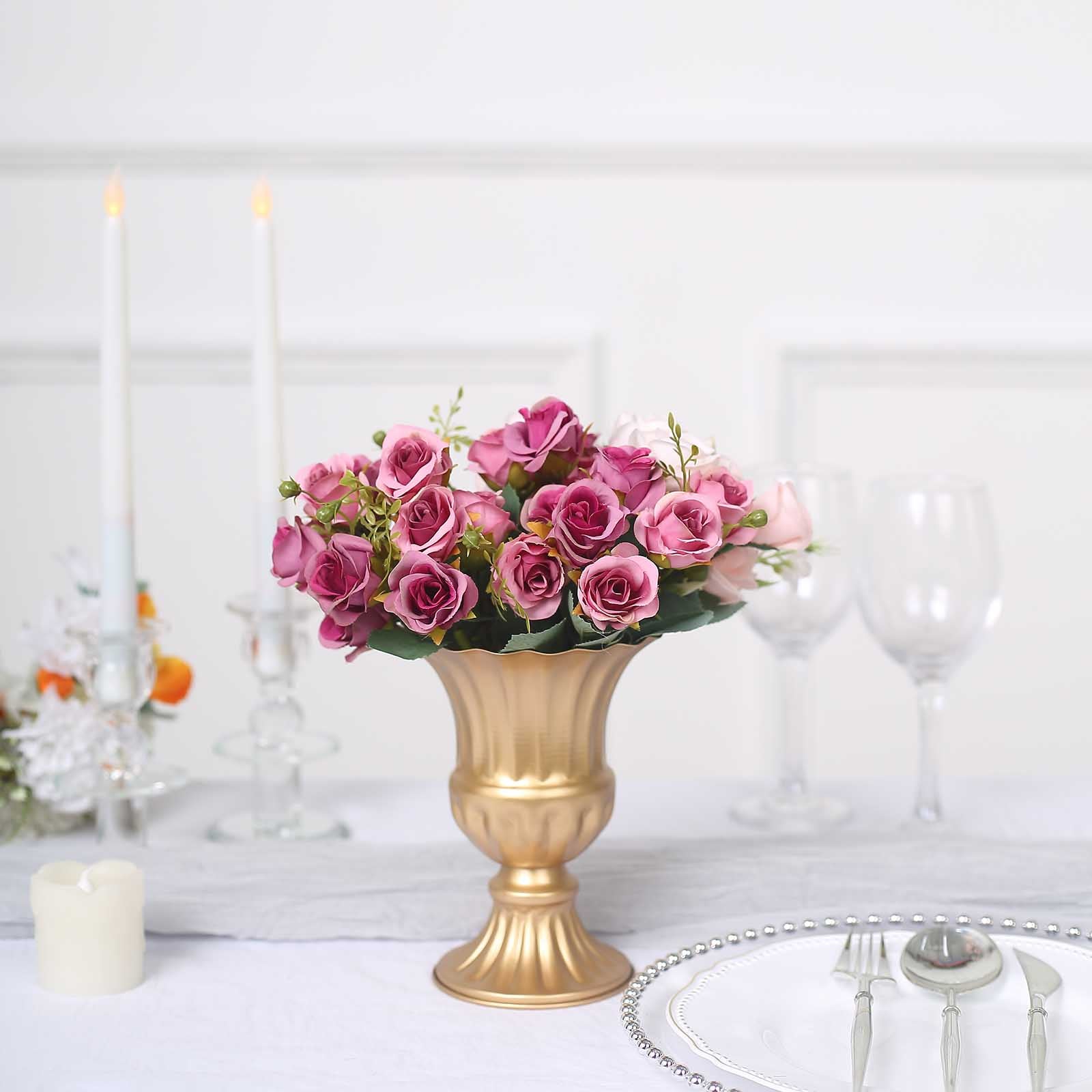 Gold metal trumpet style flower vase with pink roses, elegant tabletop decor.