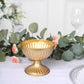 Gold metal ribbed pedestal vase in antique style, perfect for floral arrangements.