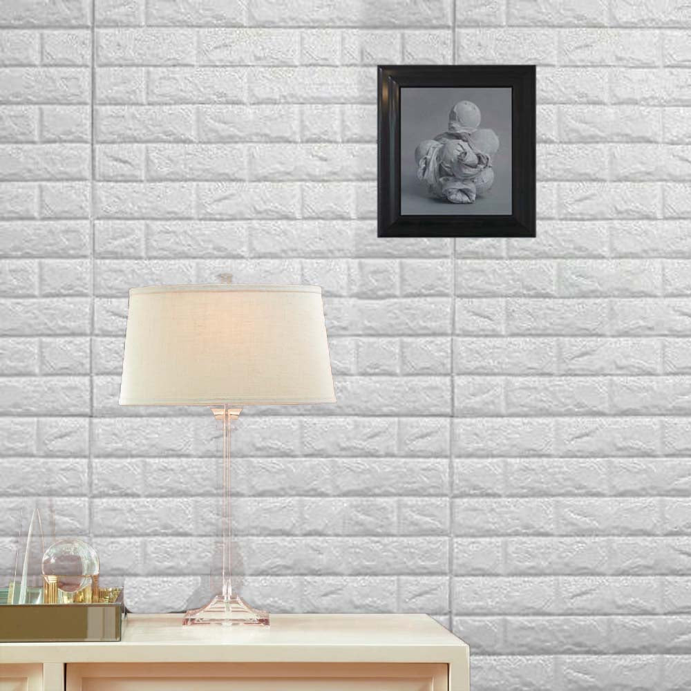 White foam brick peel and stick 3D wall tile panels covering a bright interior space.