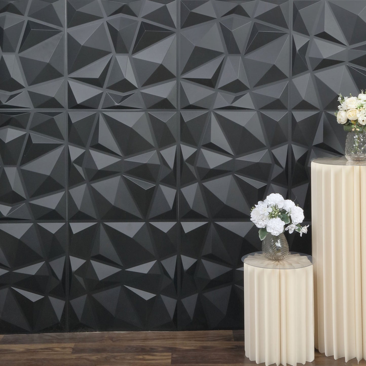 Matte black 3D diamond textured stick-on wall panels in a modern interior setting.