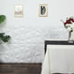 Matte white 3D diamond textured stick on wall panels in a modern setting.