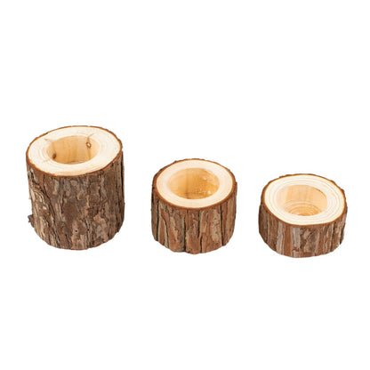 Assorted rustic wood slice tealight candle holders for farmhouse décor.