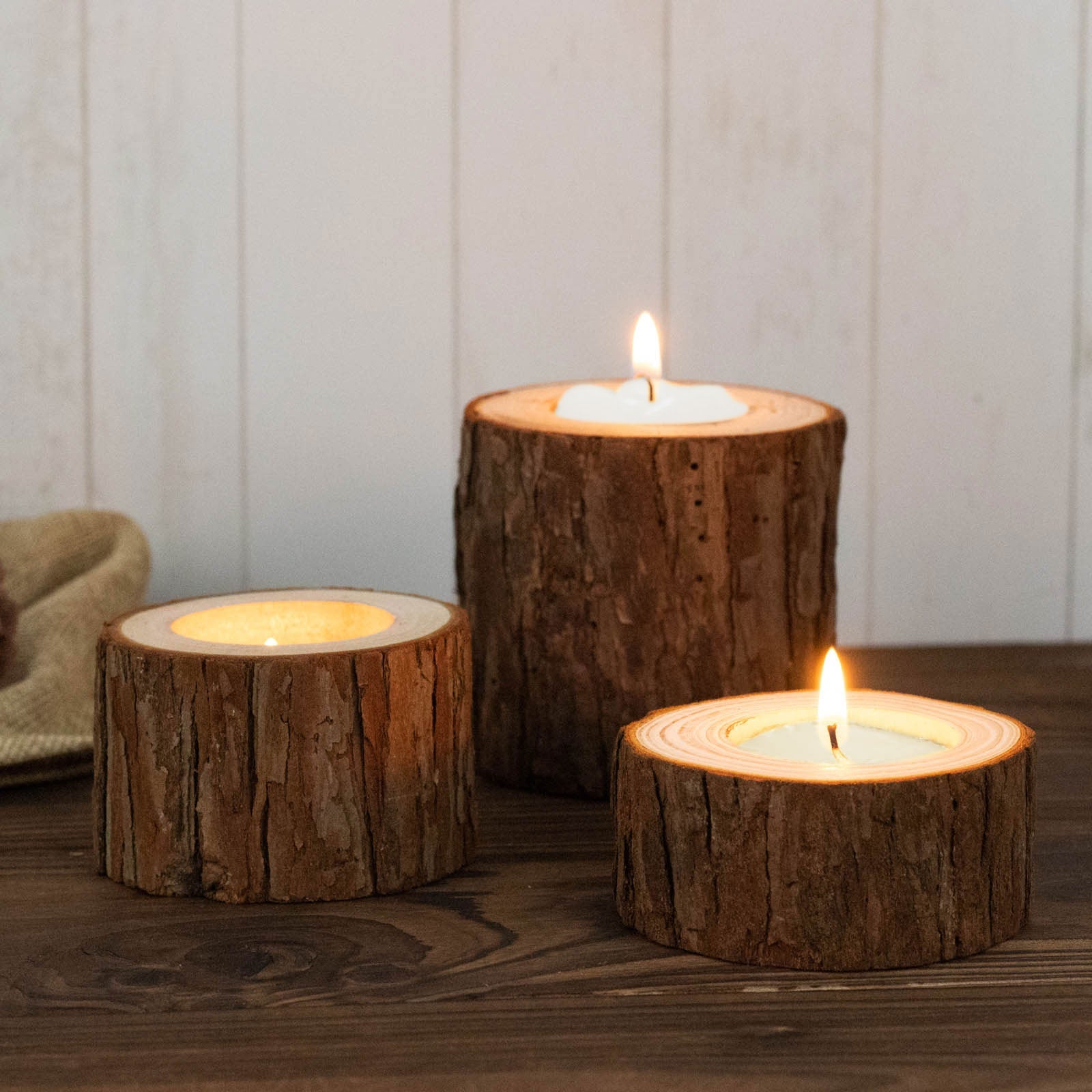 Rustic wood slice tealight candle holders for farmhouse wedding décor.