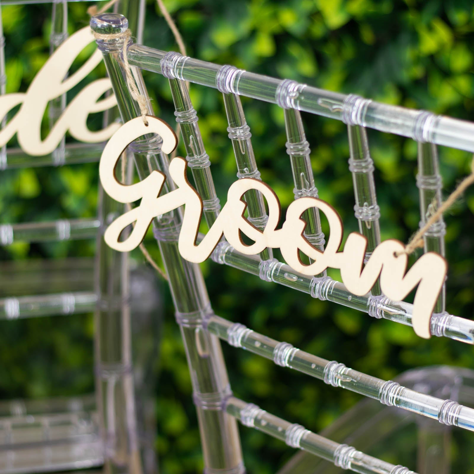 Natural wood bride and groom chair signs for wedding decor.