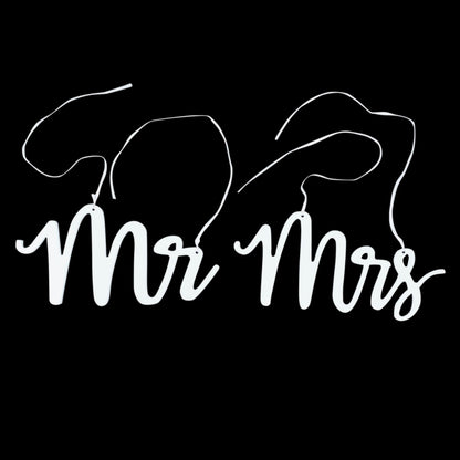 White wood Mr and Mrs chair signs with calligraphy for wedding decor.