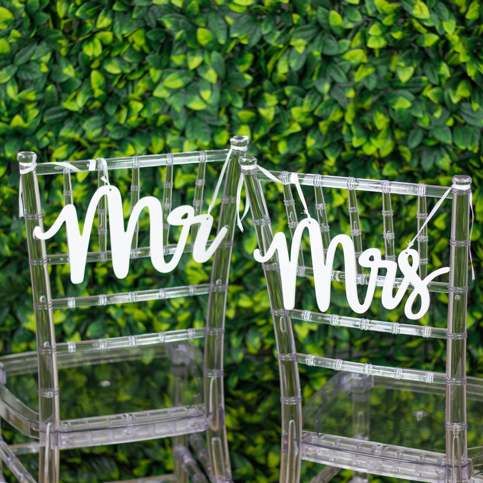 White wood Mr and Mrs chair signs for wedding decor.