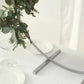 Silver metal round hoop wedding centerpiece with floral arrangement.