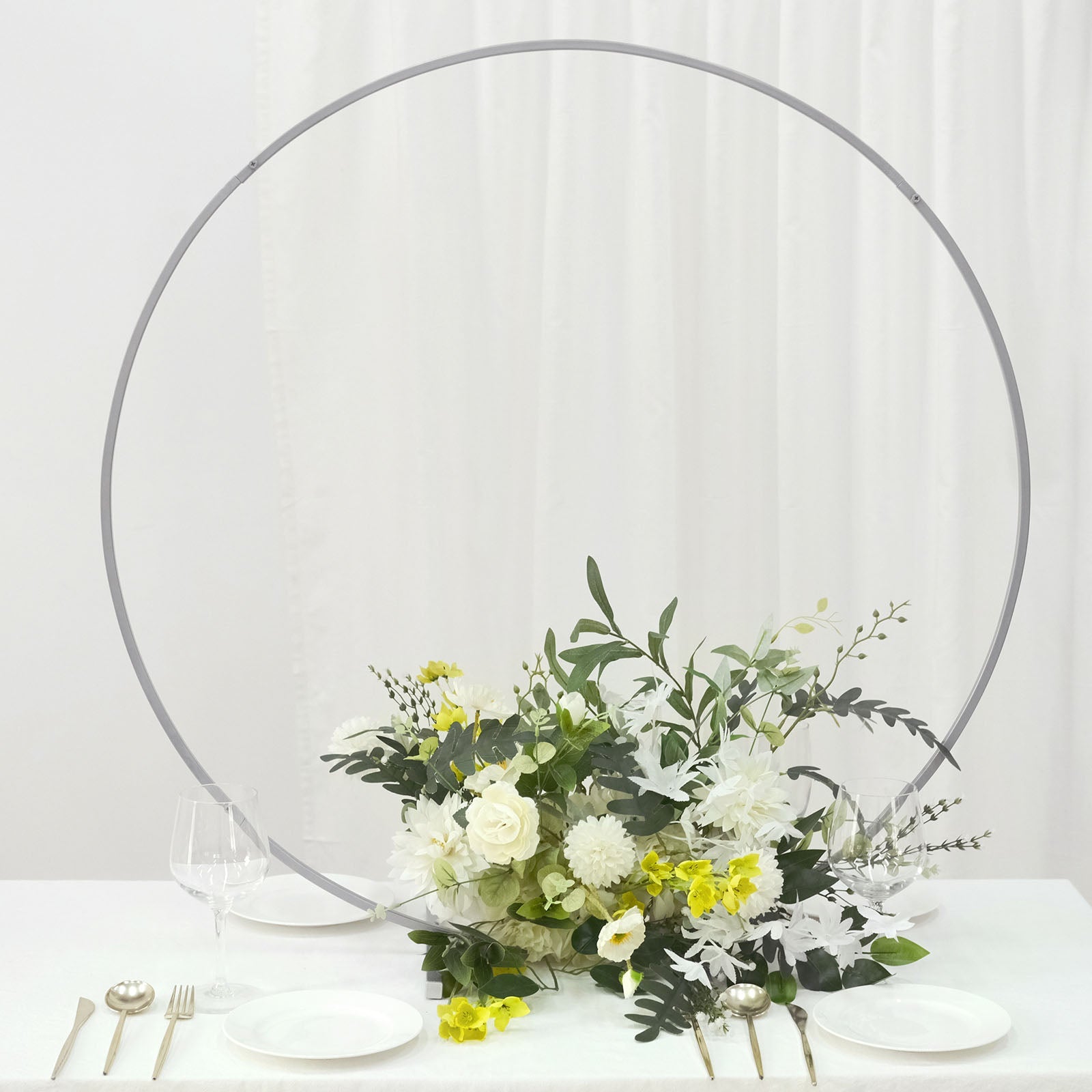 36" silver metal round hoop wedding centerpiece with floral arrangement.