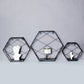 Black hexagonal floating wall shelves, decorative geometric design.