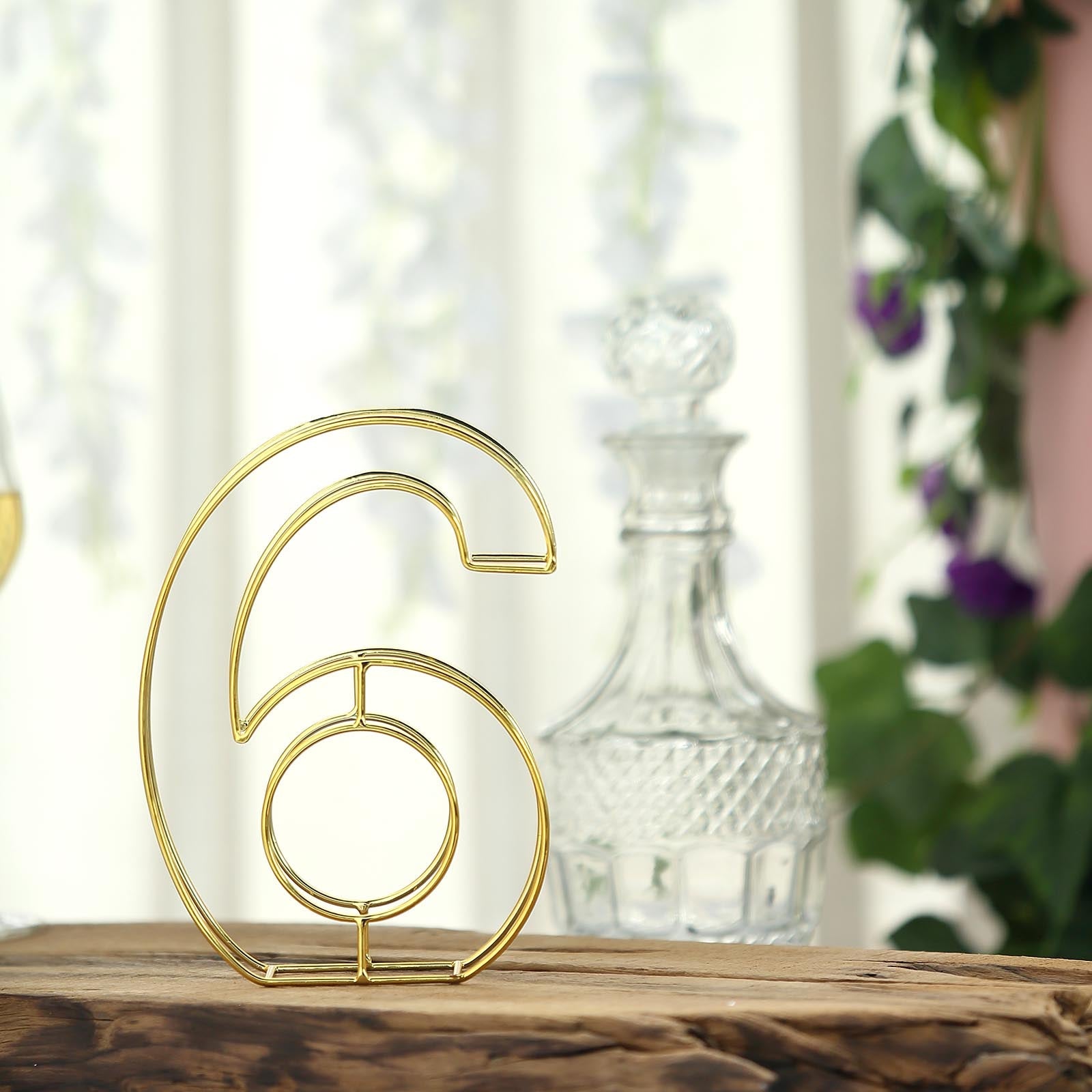 Gold freestanding 3D decorative table number 6 for weddings.