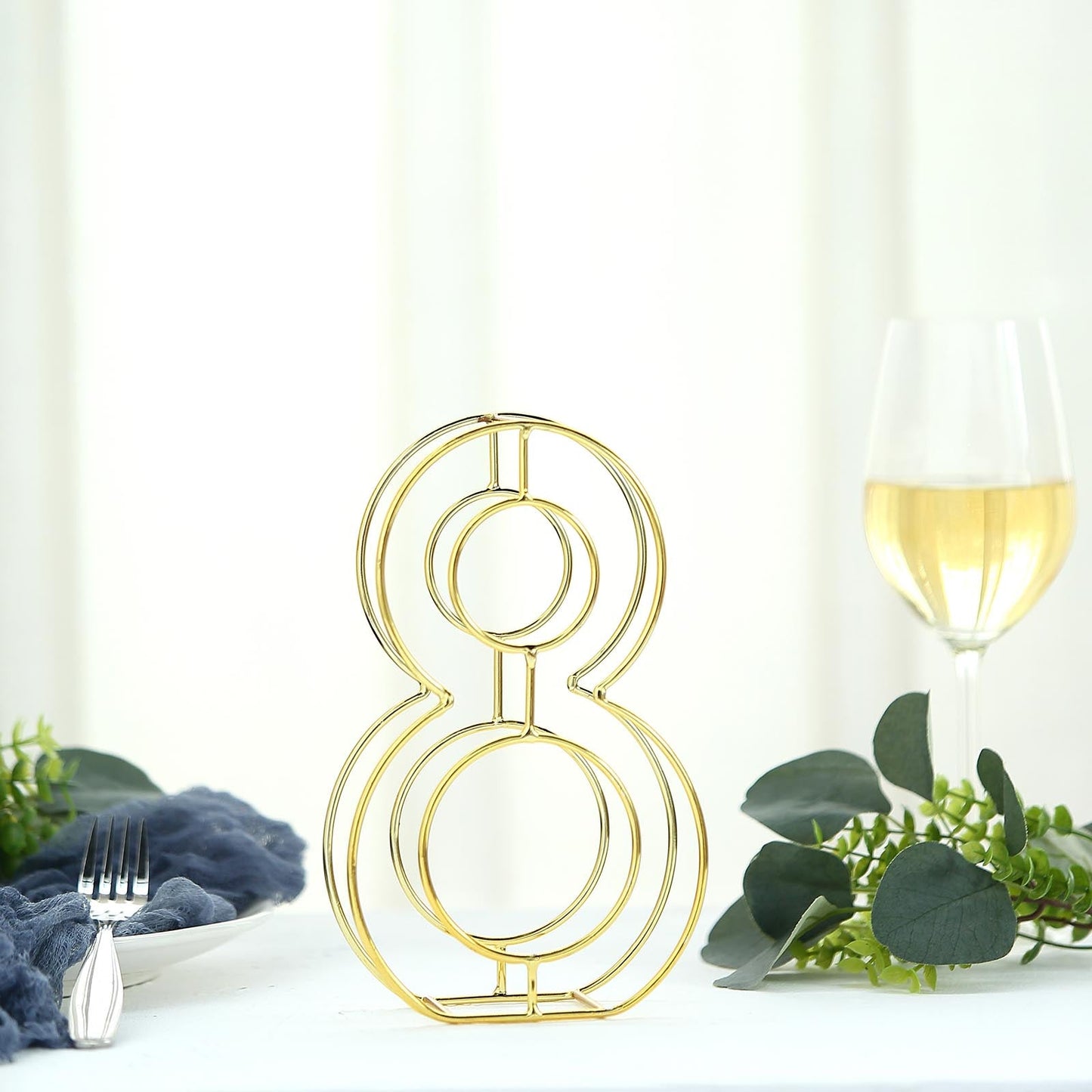 Gold freestanding decorative metal number 8 for weddings.