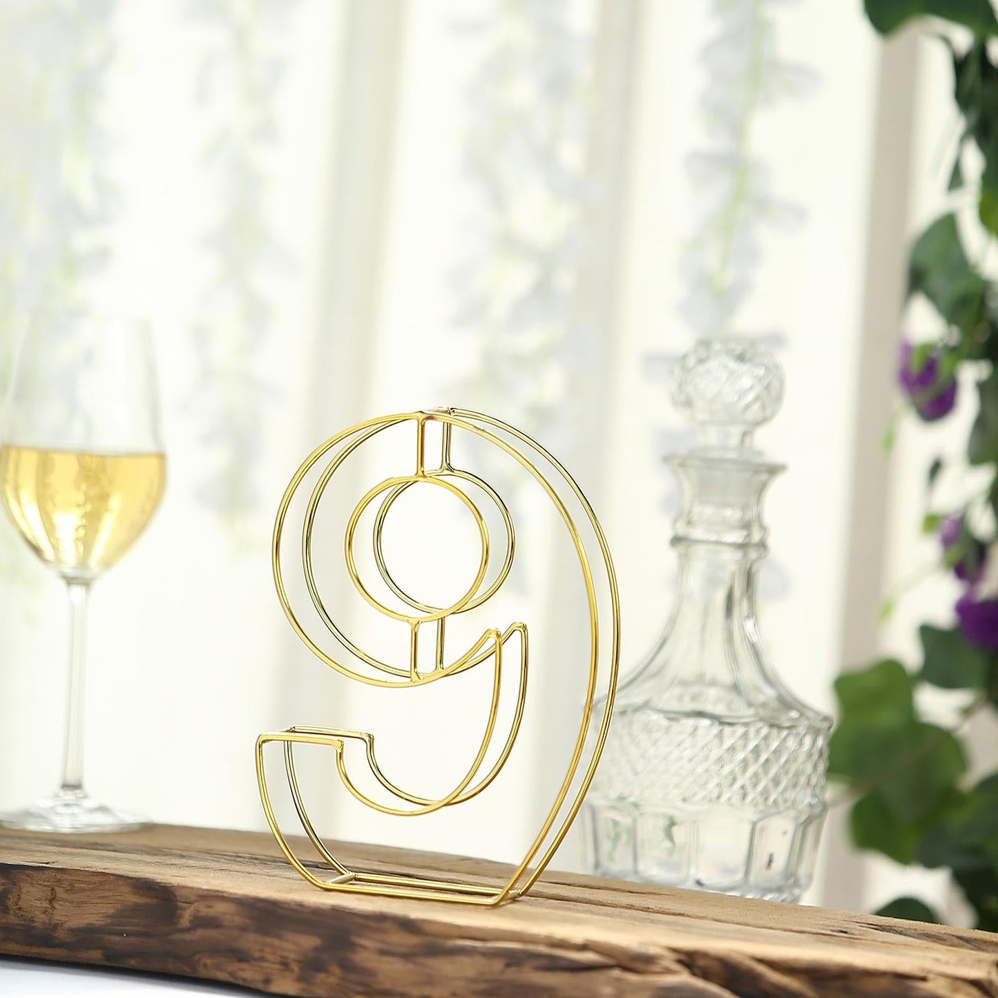 Gold freestanding decorative wedding table number 9.