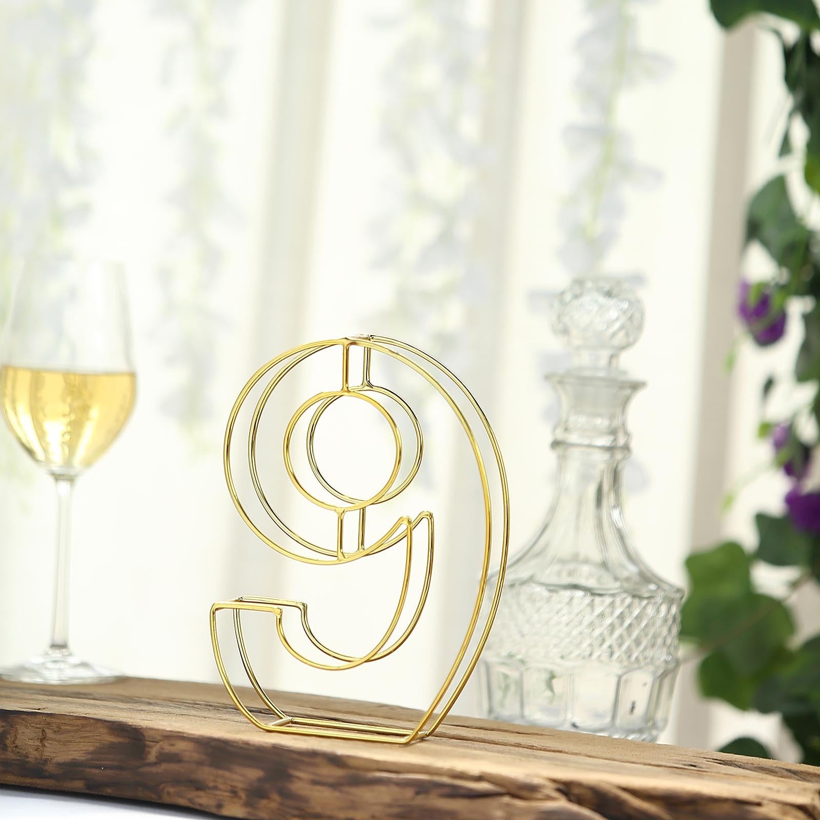 Gold freestanding decorative wedding table number 9.