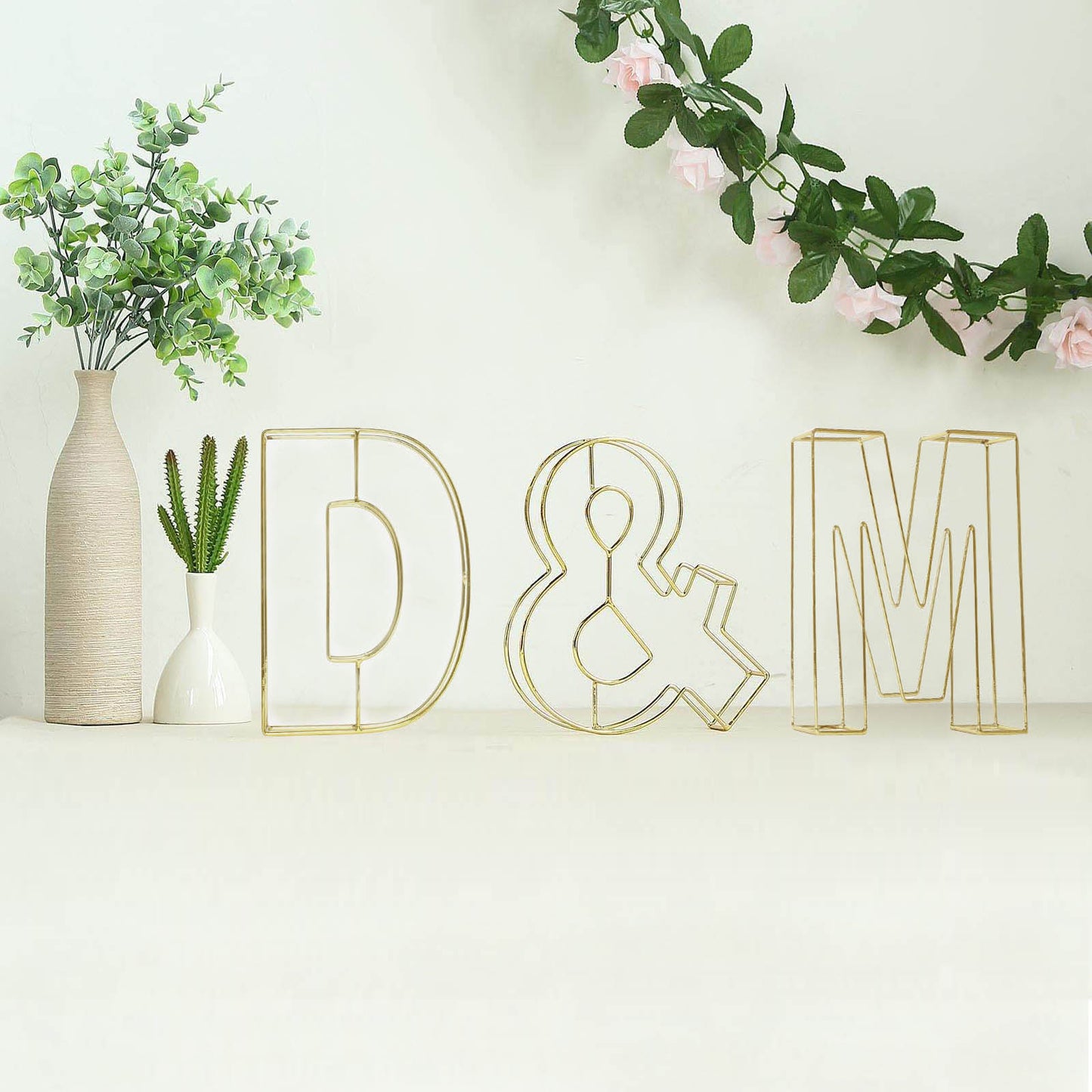 Gold 3D decorative wire letter "D" wedding centerpiece.