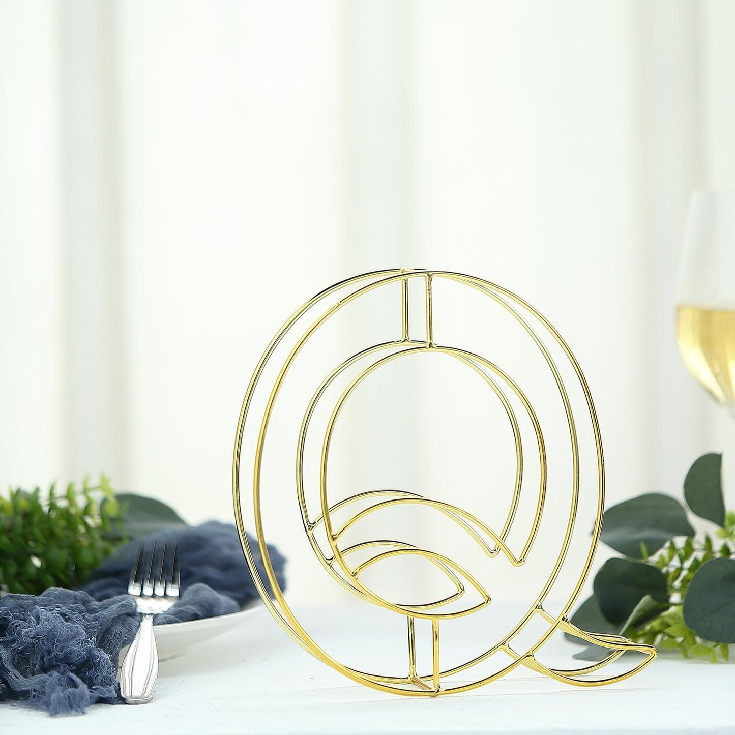 Gold decorative wire letter "Q" wedding centerpiece, 8 inches tall.