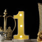 Yellow 3D marquee number 1 with warm white LED lights.
