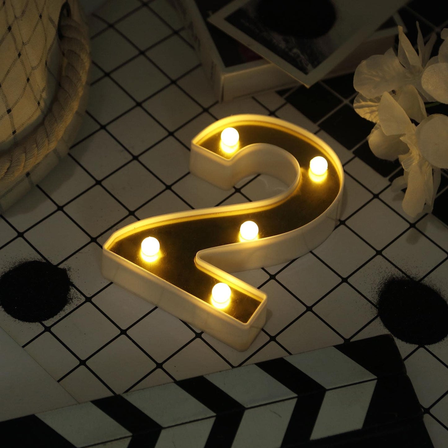 Gold 3D marquee number 2 with warm white LED lights.