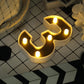 Gold 3D marquee number 3 with warm white LED lights.
