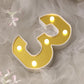 Gold 3D marquee number 3 with warm white LED lights.