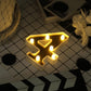 Gold 3D marquee number 4 with warm white LED lights.