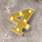Gold 3D marquee number 4 with warm white LED lights.
