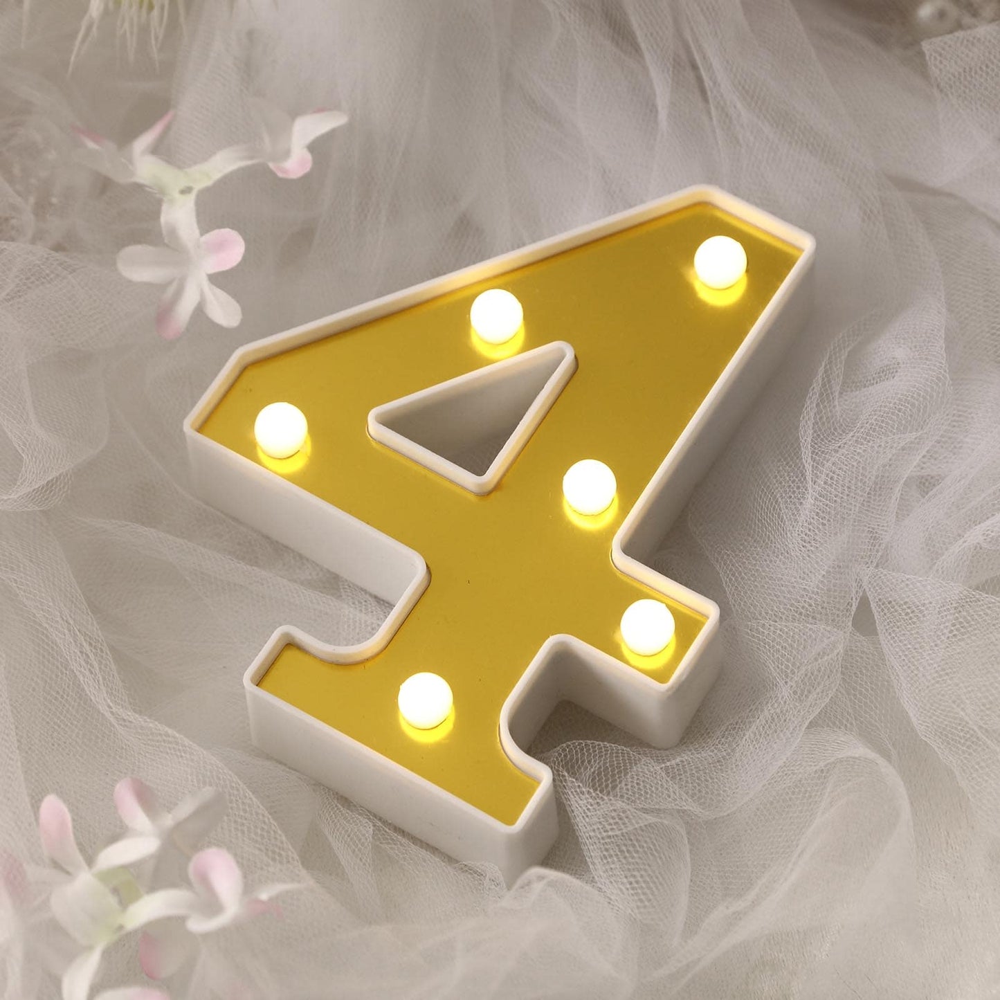 Gold 3D marquee number 4 with warm white LED lights.