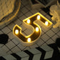 Gold 3D marquee number 5 with warm white LED lights.