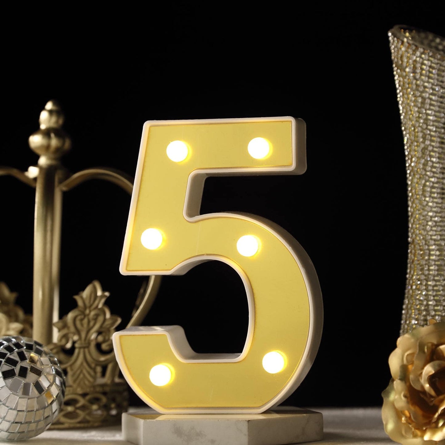 Gold 3D marquee number 5 with warm white LED lights.
