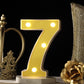 Yellow 3D marquee number 7 with warm white LED lights.
