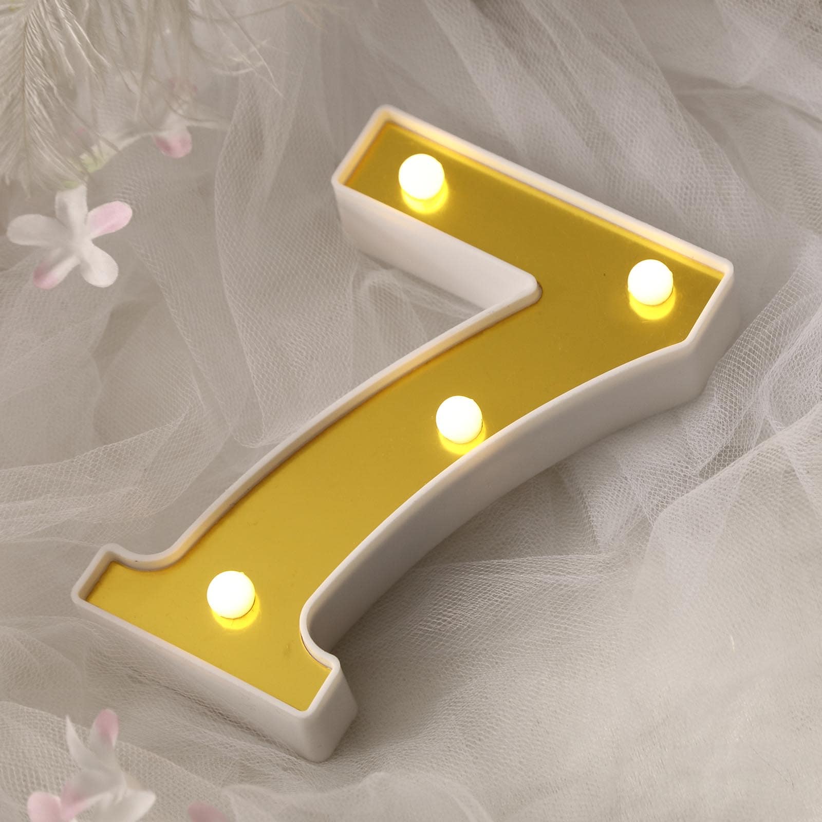 Gold 3D marquee number 7 with warm white LED lights.