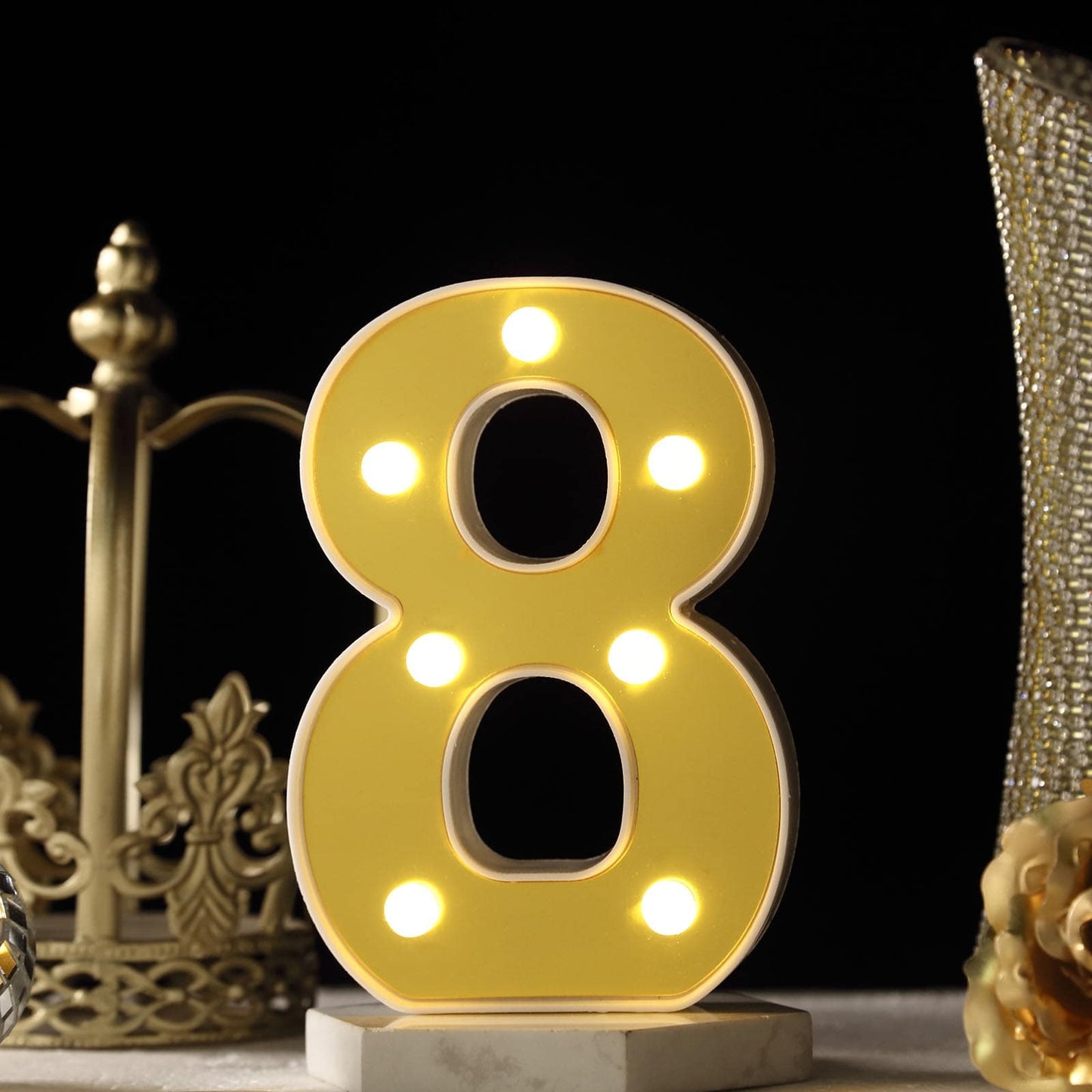 Yellow 3D marquee number 8 with warm white LED lights.