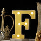 Warm white light up letter "F" with 5 LED bulbs.