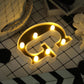 Gold 3D marquee letter "G" with warm white LED lights.