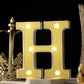 Warm white 3D marquee letter "H" with LED lights.