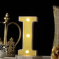Warm white 3D marquee letter "I" with LED lights.