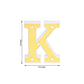 Gold 3D marquee letter "K" with warm white LED lights.