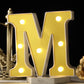 Gold 3D marquee letter "M" with warm white LED lights.