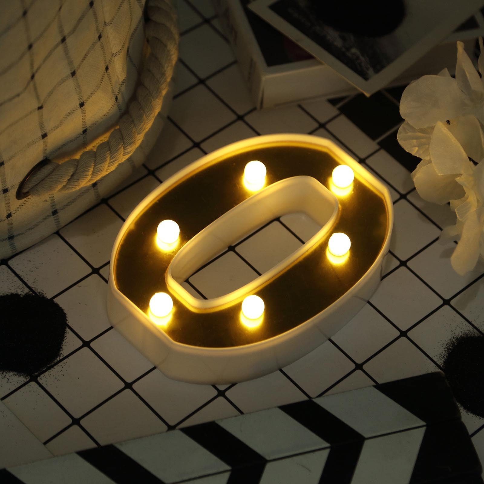 Gold 3D marquee letter "O" with warm white LED lights.