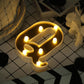 Gold 3D marquee letter "Q" with warm white LED lights.
