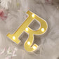Warm white 3D marquee letter 'R' with LED lights.