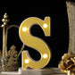 Warm white 3D marquee letter "S" with LED lights.