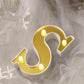 Gold 3D marquee letter 'S' with warm white LED lights